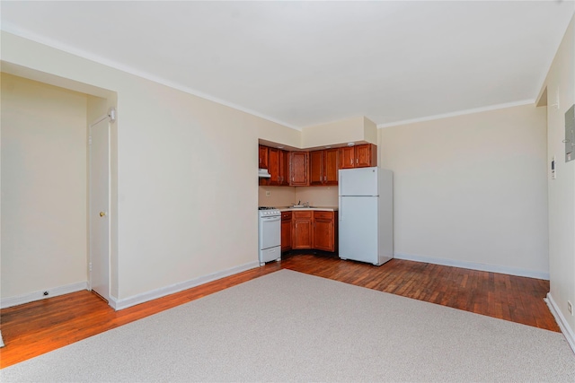9430 Ridge Blvd Unit 6F, Brooklyn, NY 11209 - kitchen with white appliances, dark wood-style floors, light countertops, baseboards, and brown cabinetry