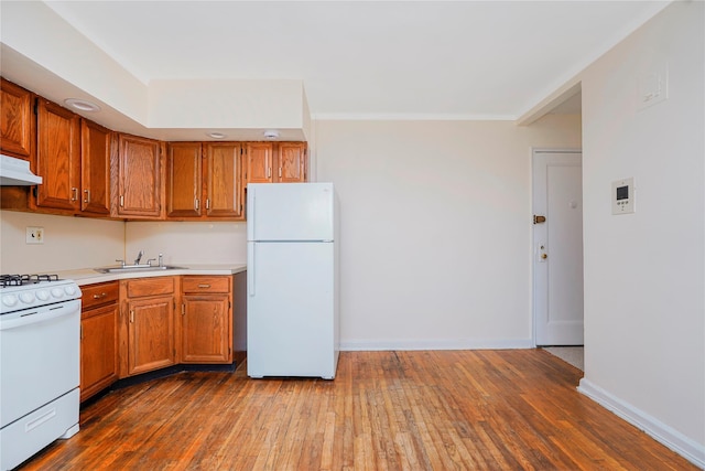 9430 Ridge Blvd Unit 6F, Brooklyn, NY 11209 - kitchen featuring white appliances, hardwood / wood-style flooring, and brown cabinets
