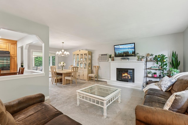 118 Standish Dr, Pearl River, NY 10965 - living room featuring a brick fireplace, a chandelier, light carpet, a wall mounted AC, and baseboard heating
