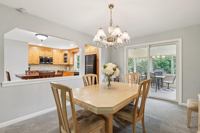 118 Standish Dr, Pearl River, NY 10965 - dining area with light colored carpet, a chandelier, and recessed lighting