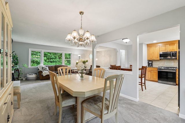 118 Standish Dr, Pearl River, NY 10965 - dining space featuring light colored carpet, a chandelier, and light tile patterned flooring