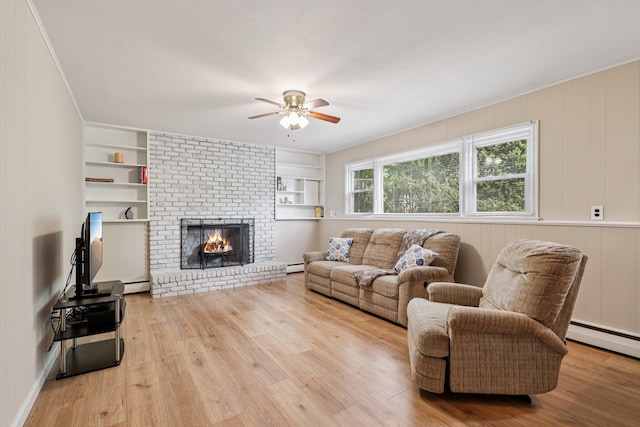 118 Standish Dr, Pearl River, NY 10965 - living room featuring ceiling fan, built in features, wood finished floors, and a fireplace
