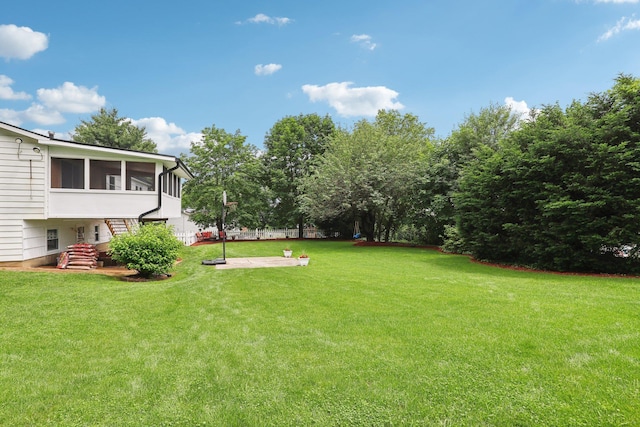 118 Standish Dr, Pearl River, NY 10965 - view of grassy yard featuring a sunroom, stairs, and a patio area