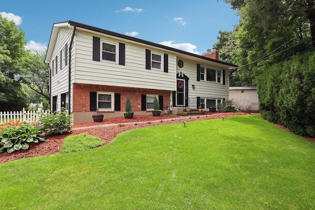 118 Standish Dr, Pearl River, NY 10965 - raised ranch featuring a chimney and brick siding