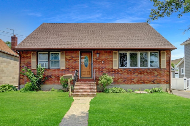 104 S 3rd St, New Hyde Park, NY 11040 - view of front of house featuring brick siding, a shingled roof, and cooling unit