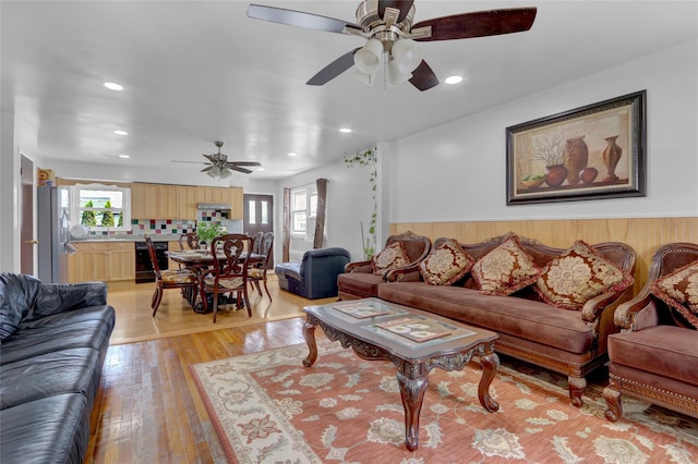 104 S 3rd St, New Hyde Park, NY 11040 - living room with a ceiling fan, light wood-style floors, and recessed lighting