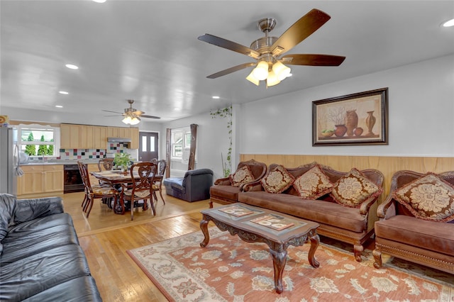 104 S 3rd St, New Hyde Park, NY 11040 - living room featuring a ceiling fan, light wood finished floors, recessed lighting, and wainscoting