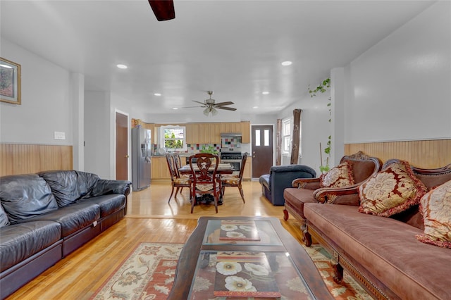 104 S 3rd St, New Hyde Park, NY 11040 - living area featuring ceiling fan, wainscoting, light wood-type flooring, and recessed lighting