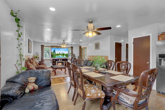 104 S 3rd St, New Hyde Park, NY 11040 - dining room with ceiling fan, light wood-style flooring, recessed lighting, and a glass covered fireplace