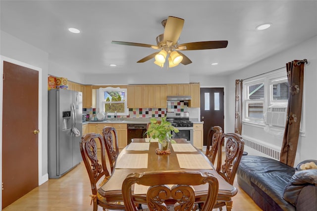 104 S 3rd St, New Hyde Park, NY 11040 - dining space featuring radiator heating unit, recessed lighting, light wood-style floors, a ceiling fan, and cooling unit