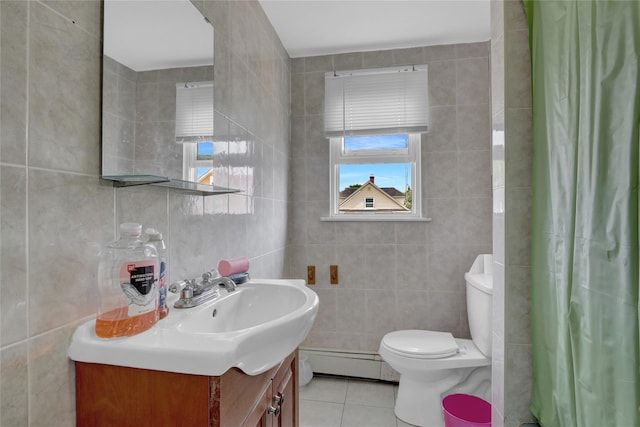 104 S 3rd St, New Hyde Park, NY 11040 - bathroom with a baseboard radiator, tile walls, tile patterned flooring, vanity, and a shower with shower curtain