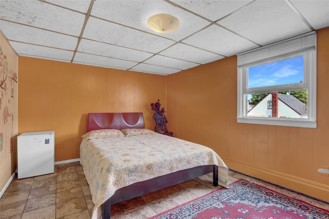 104 S 3rd St, New Hyde Park, NY 11040 - bedroom featuring baseboards and a drop ceiling