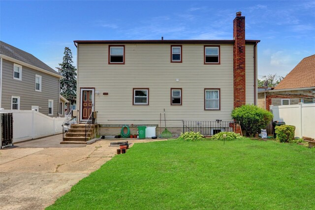 104 S 3rd St, New Hyde Park, NY 11040 - rear view of property with a chimney