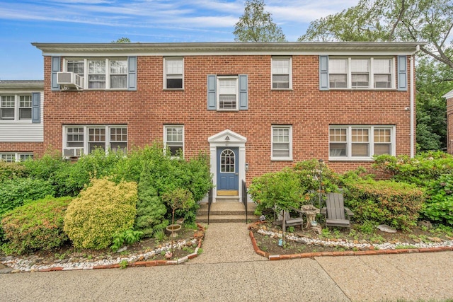 61 Columbus Ave Unit 1B, West Harrison, NY 10604 - view of front facade featuring brick siding and cooling unit