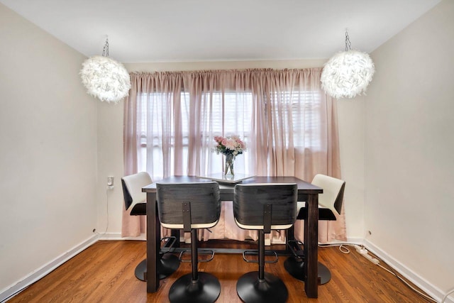 61 Columbus Ave Unit 1B, West Harrison, NY 10604 - dining area featuring wood finished floors and a chandelier