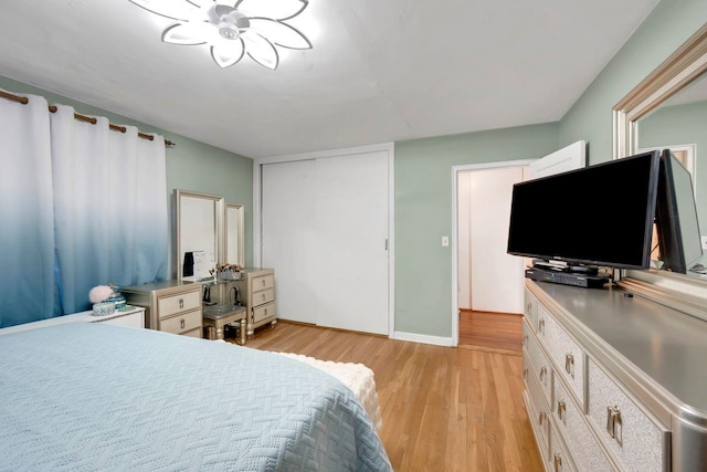 61 Columbus Ave Unit 1B, West Harrison, NY 10604 - bedroom featuring light wood-style flooring and a closet