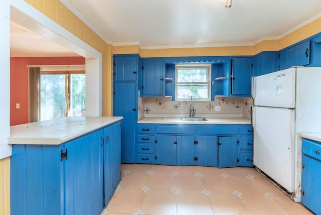 872-874 Rte 212, Saugerties, NY 12477 - kitchen with freestanding refrigerator, a sink, blue cabinetry, and light countertops
