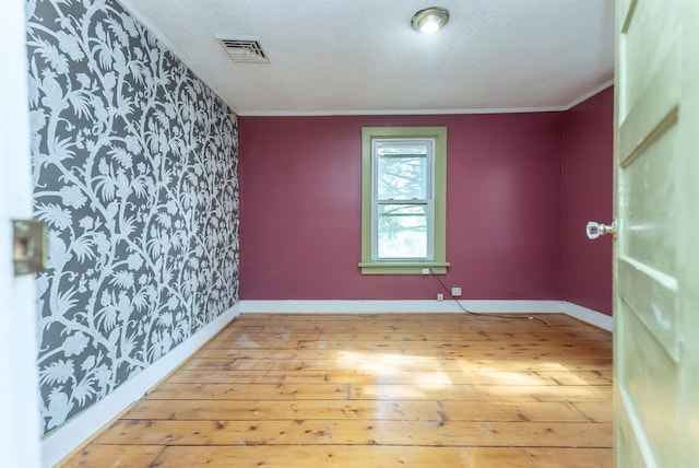 872-874 Rte 212, Saugerties, NY 12477 - unfurnished room featuring hardwood / wood-style floors, wallpapered walls, a textured ceiling, and baseboards