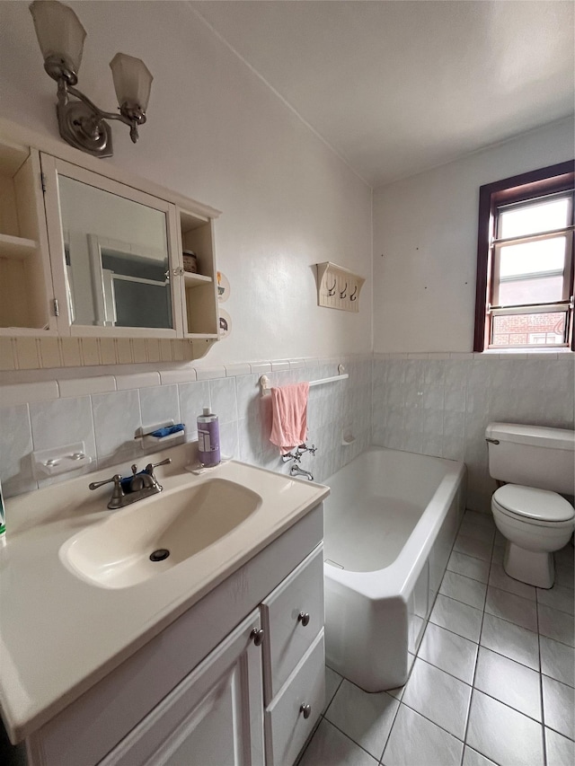 9941 64th Ave Unit F12, Rego Park, NY 11374 - bathroom featuring tile walls, vanity, toilet, tile patterned flooring, and a bath