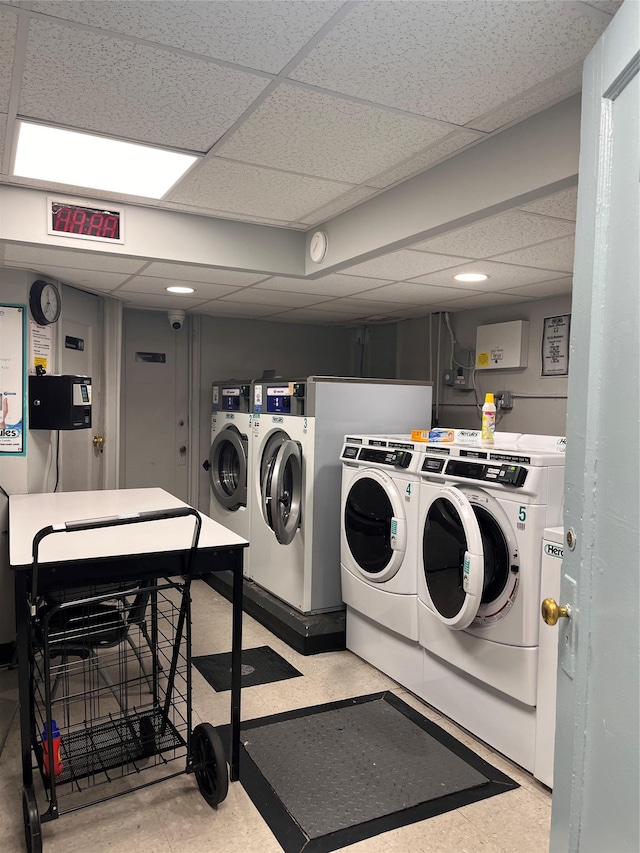 9941 64th Ave Unit F12, Rego Park, NY 11374 - community laundry with washing machine and dryer and tile patterned floors
