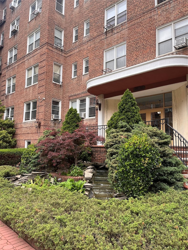 9941 64th Ave Unit F12, Rego Park, NY 11374 - view of apartment building / complex with stairway