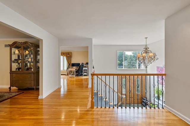 15 Dunmore Rd, New City, NY 10956 - hall featuring a chandelier and wood finished floors
