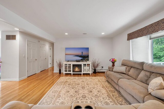 15 Dunmore Rd, New City, NY 10956 - living room featuring light wood-style flooring, recessed lighting, and baseboard heating