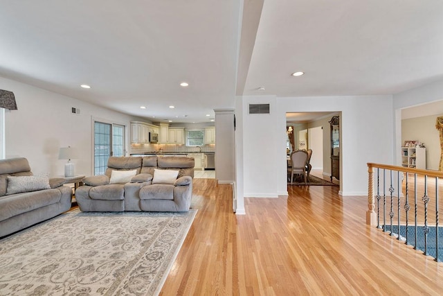 15 Dunmore Rd, New City, NY 10956 - living room featuring light wood-style flooring and recessed lighting