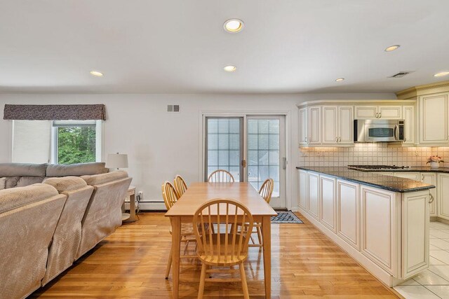15 Dunmore Rd, New City, NY 10956 - dining area featuring recessed lighting, light wood finished floors, and a baseboard radiator