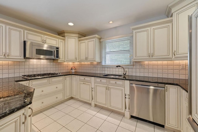 15 Dunmore Rd, New City, NY 10956 - kitchen with cream cabinets, stainless steel appliances, light tile patterned floors, and recessed lighting