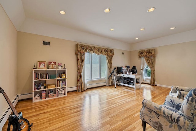 15 Dunmore Rd, New City, NY 10956 - living area with light wood-style floors, a baseboard heating unit, recessed lighting, a desk, and baseboard heating