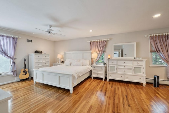 15 Dunmore Rd, New City, NY 10956 - bedroom with light wood-style flooring, a ceiling fan, a baseboard radiator, and recessed lighting