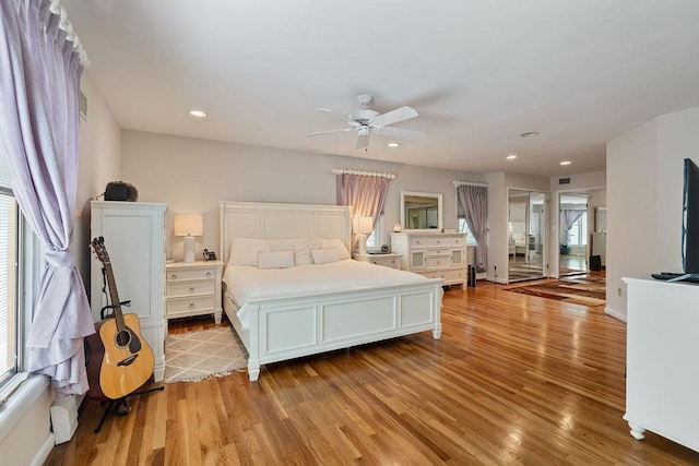 15 Dunmore Rd, New City, NY 10956 - bedroom with light wood-style floors, multiple windows, and recessed lighting