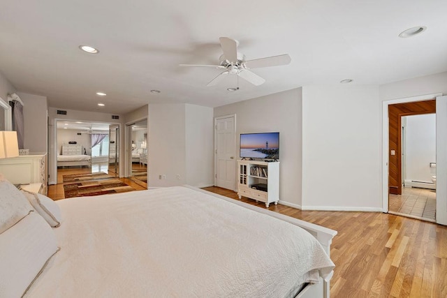 15 Dunmore Rd, New City, NY 10956 - bedroom featuring a baseboard radiator, light wood-type flooring, recessed lighting, ensuite bath, and ceiling fan