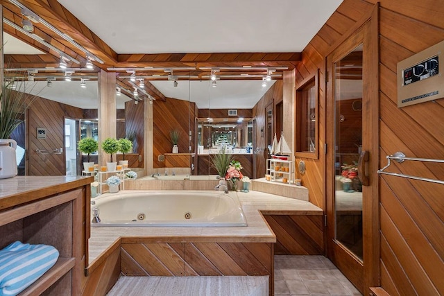15 Dunmore Rd, New City, NY 10956 - full bathroom featuring wood walls, a tub with jets, and vanity