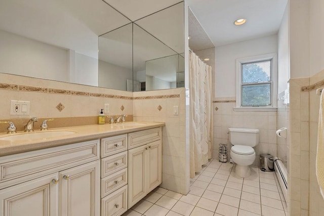 15 Dunmore Rd, New City, NY 10956 - full bath with tile walls, tile patterned floors, double vanity, a wainscoted wall, and a shower with curtain