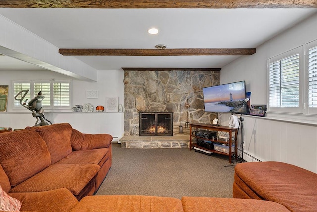 15 Dunmore Rd, New City, NY 10956 - living room with beamed ceiling, carpet flooring, a stone fireplace, and a baseboard heating unit