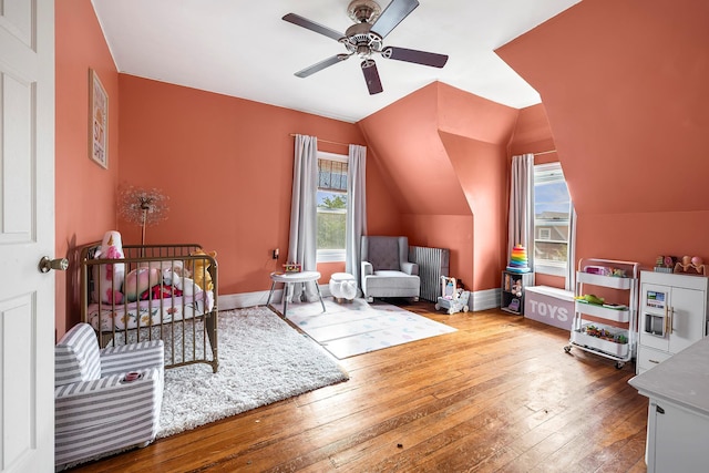 115 Primrose Ave, Mount Vernon, NY 10552 - bedroom with multiple windows, hardwood / wood-style floors, lofted ceiling, and a ceiling fan