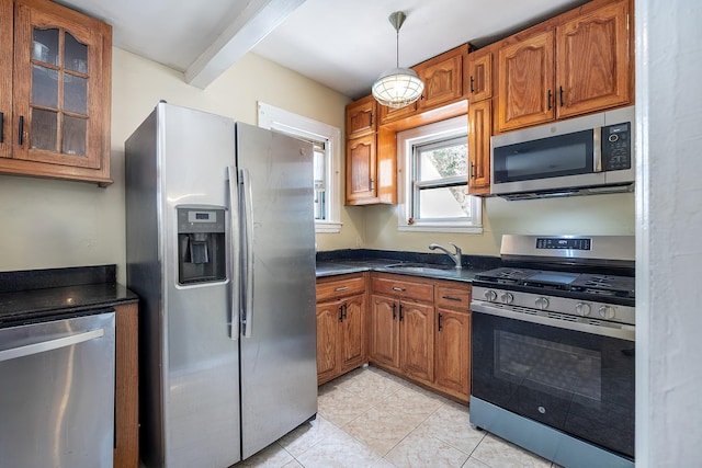 115 Primrose Ave, Mount Vernon, NY 10552 - kitchen featuring appliances with stainless steel finishes, brown cabinets, glass insert cabinets, and light tile patterned flooring