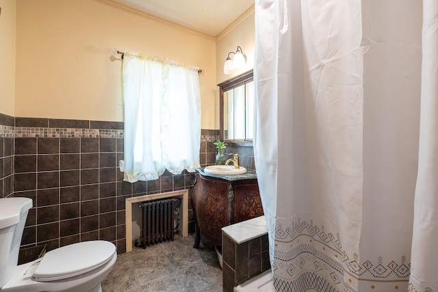 115 Primrose Ave, Mount Vernon, NY 10552 - bathroom featuring radiator heating unit, crown molding, tile walls, a shower with curtain, and vanity
