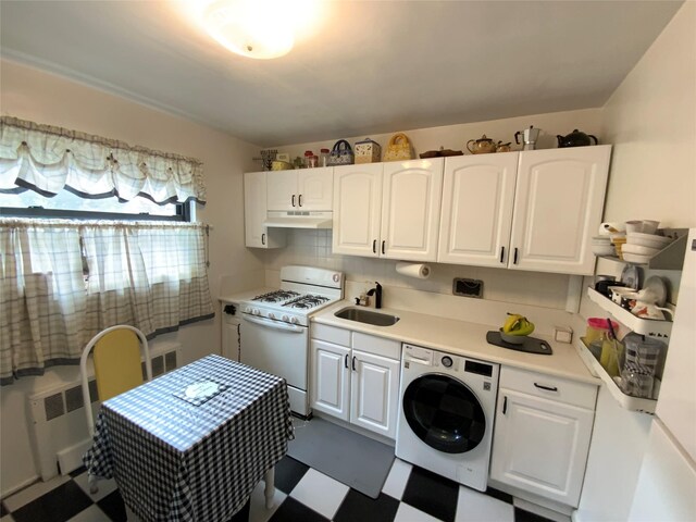 73-19 217th St Unit Nd, Oakland Gardens, NY 11364 - washroom with washer / dryer and dark flooring