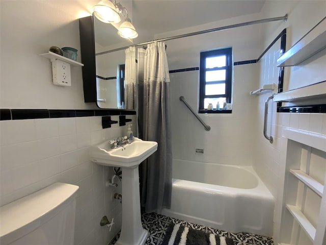 73-19 217th St Unit Nd, Oakland Gardens, NY 11364 - bathroom with shower / tub combo with curtain, tile walls, and tile patterned flooring