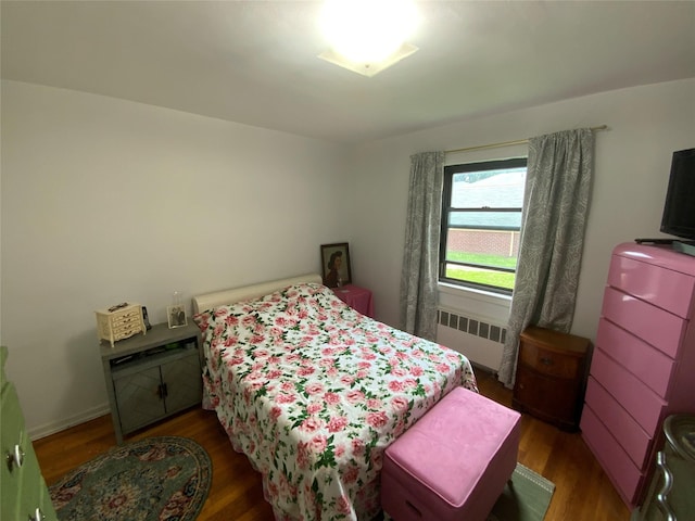73-19 217th St Unit Nd, Oakland Gardens, NY 11364 - bedroom with radiator and wood finished floors