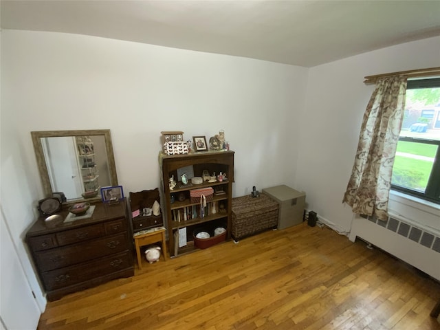 73-19 217th St Unit Nd, Oakland Gardens, NY 11364 - office area featuring wood finished floors and radiator heating unit