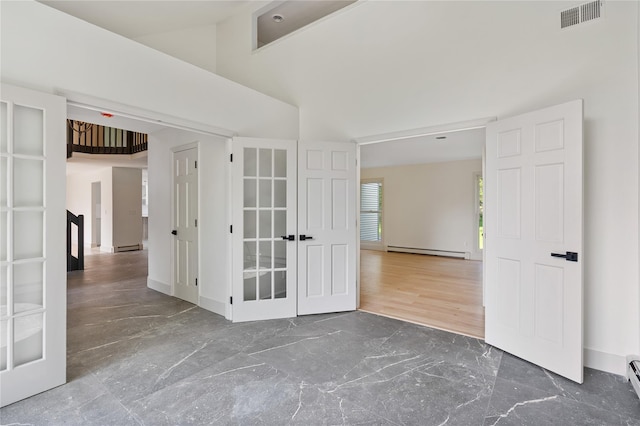 17 Royal Ct, Warwick, NY 10990 - spare room with a baseboard radiator and high vaulted ceiling