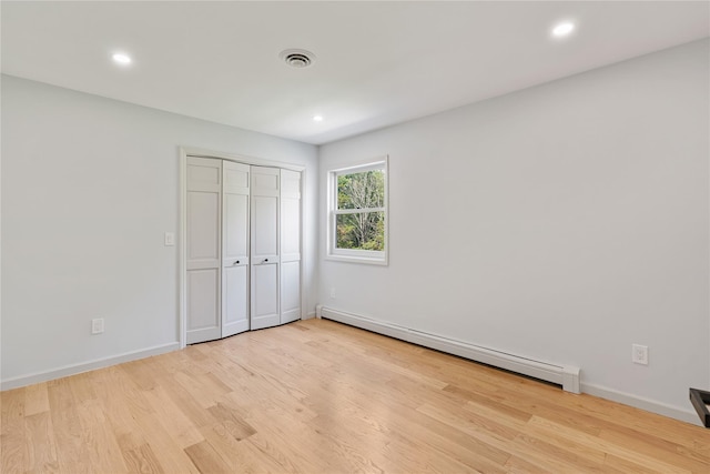 17 Royal Ct, Warwick, NY 10990 - unfurnished bedroom featuring a baseboard heating unit, light wood-style flooring, recessed lighting, and a closet