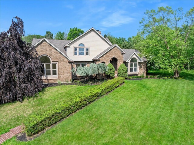17 Royal Ct, Warwick, NY 10990 - traditional-style home with brick siding, a front lawn, and a chimney