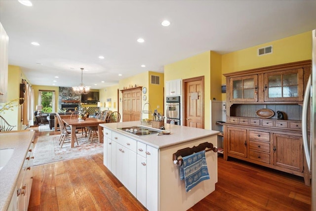 1034 Rte 292, Holmes, NY 12531 - kitchen with wood-type flooring, electric stovetop, a chandelier, open floor plan, and recessed lighting