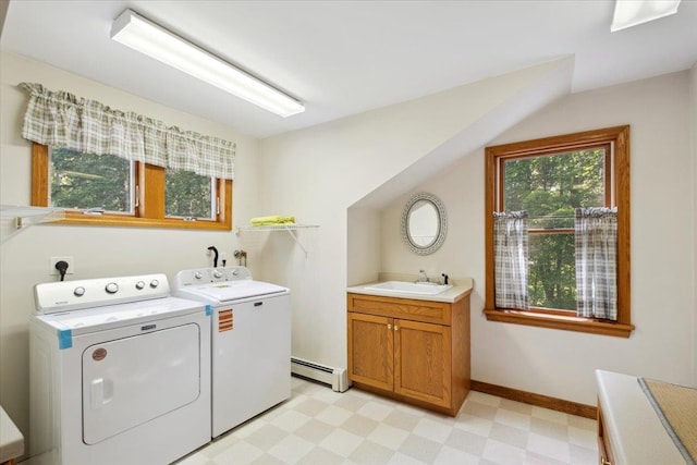 1034 Rte 292, Holmes, NY 12531 - laundry area featuring a baseboard radiator, separate washer and dryer, light floors, and cabinet space