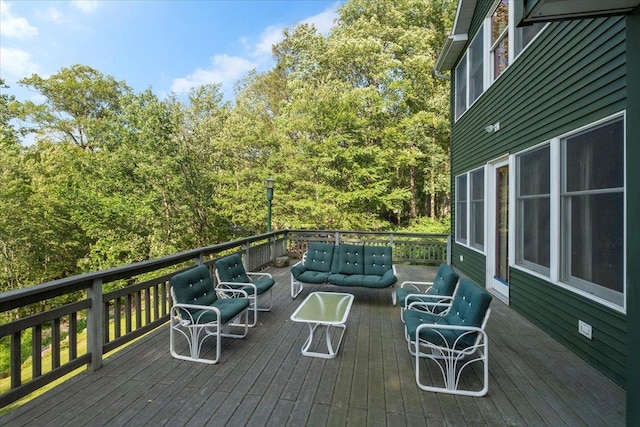 1034 Rte 292, Holmes, NY 12531 - wooden terrace featuring an outdoor hangout area and a wooded view